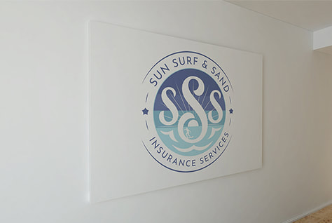 Sun, Surf & Sand Insurance Services logo printed on a frame